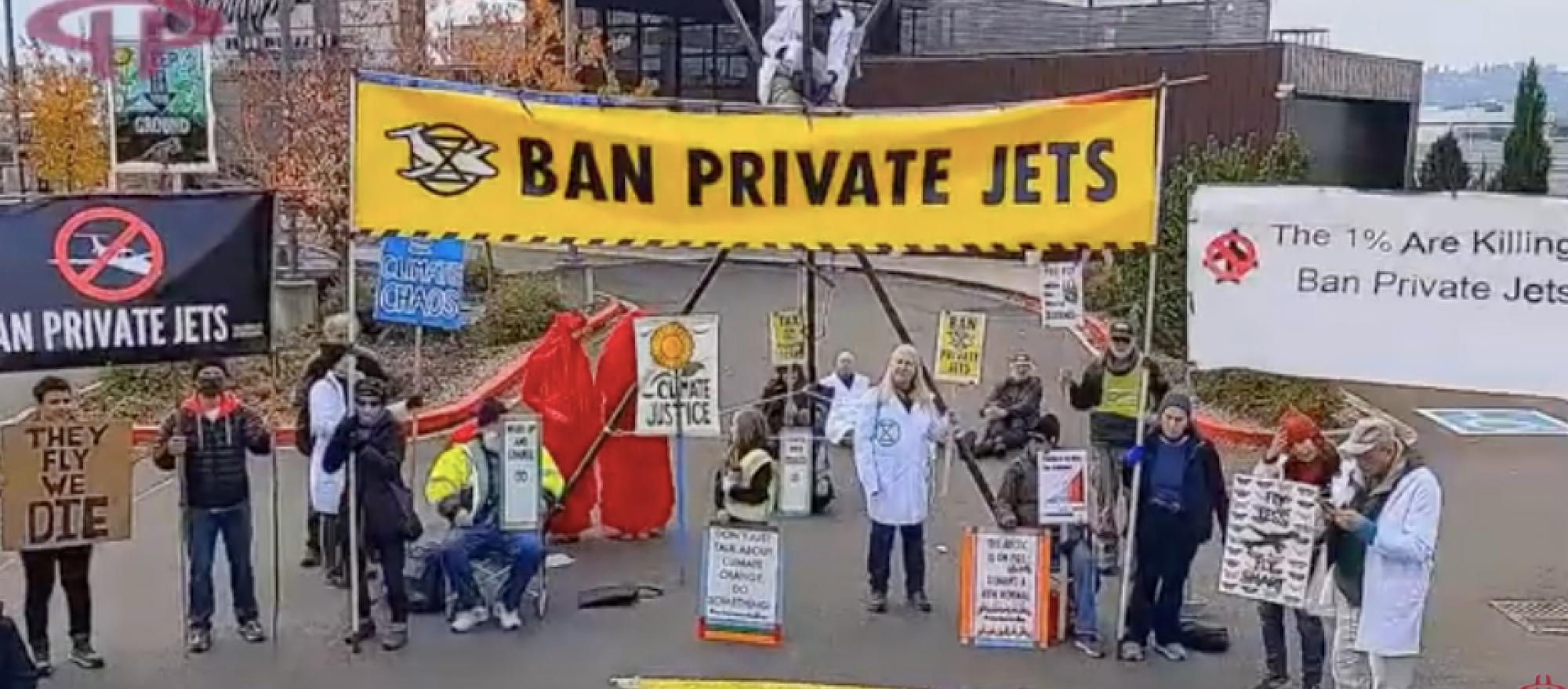 Environmental activists protest at King County International Airport/Boeing Field in Seattle on Nov. 10.