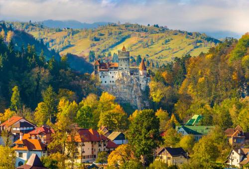 Panoramic view over Bran Castle (commonly known as Dracula's Castle). Photo: Adobe Stock