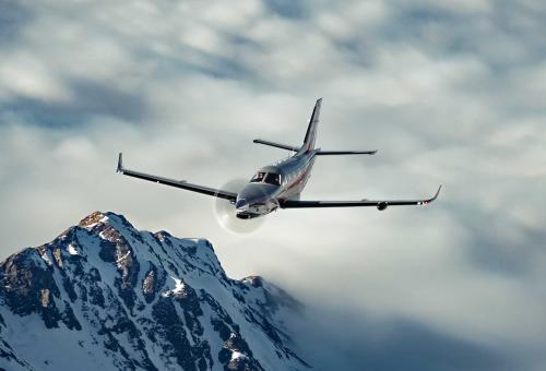 Daher TBM 960 in flight over snow capped mountains