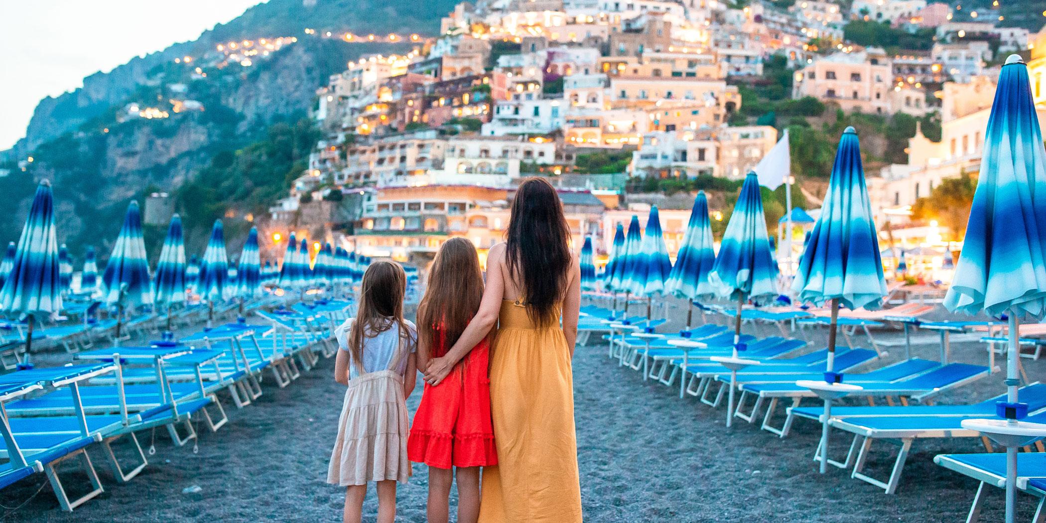 A family views Positano on the Amalfi coast. Photo: Adobe Stock