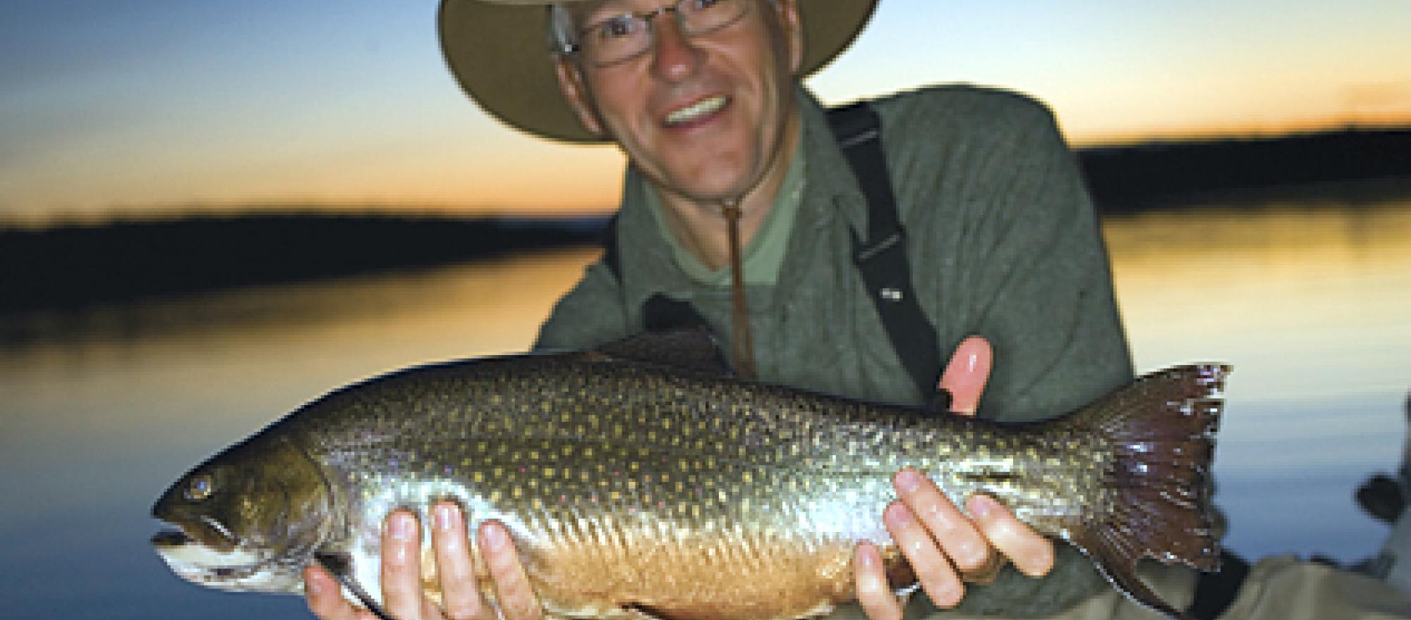 The author, Thomas R. Pero,  holds a six-pound trout. 