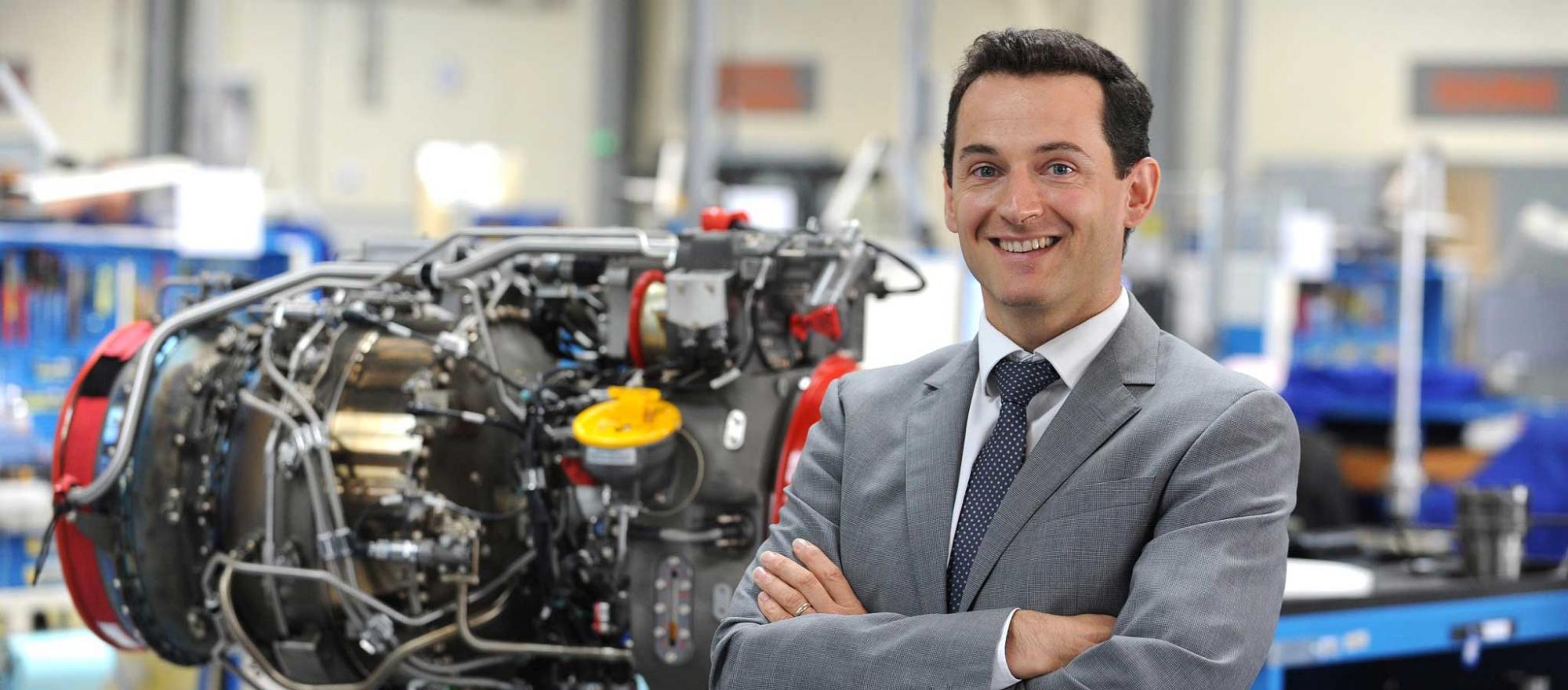 man standing in front of engine