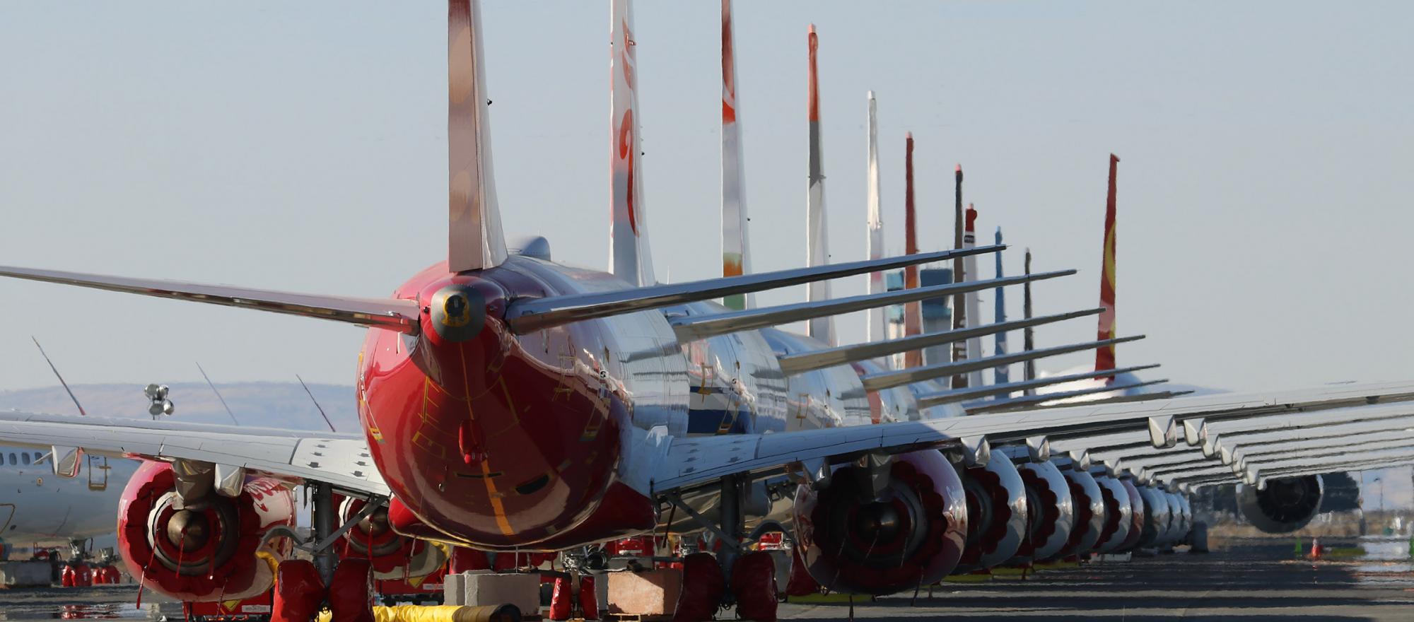 A row of stored 737 Max jets sits idle in Moses Lake, Washington, awaiting an FAA directive to allow the model to re-enter service. (Photo: Barry Ambrose)