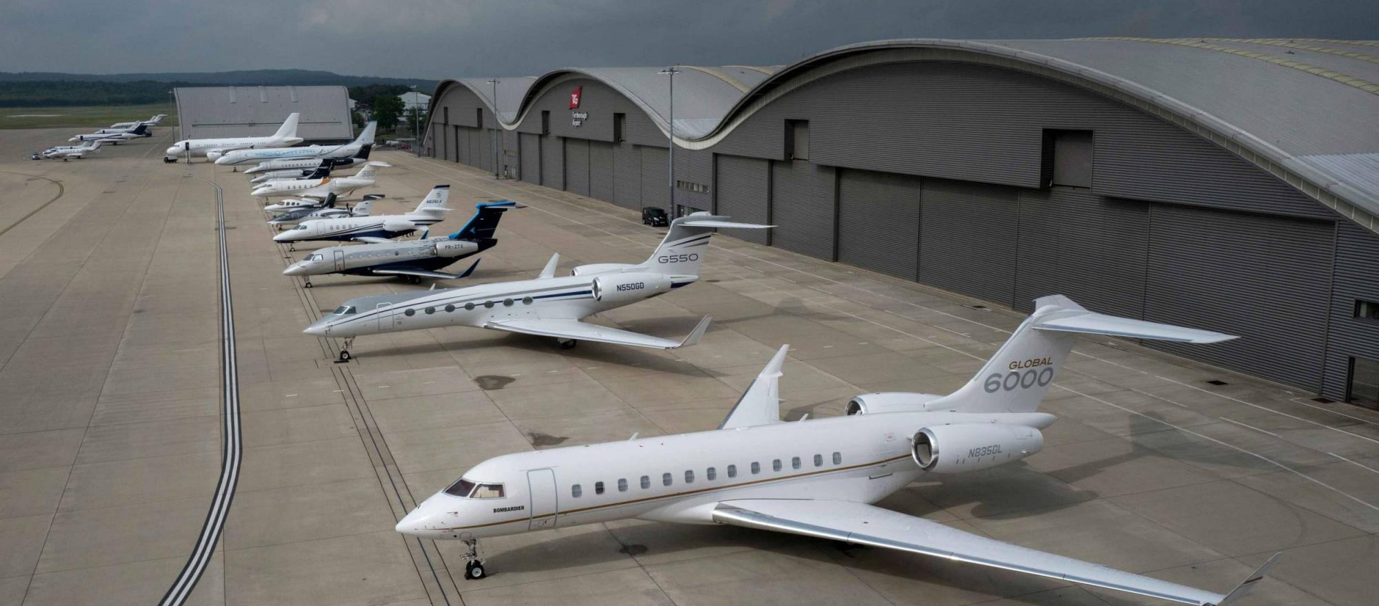 Aerial view of business jets parked outside hangars at Farnborough SAF event 2020