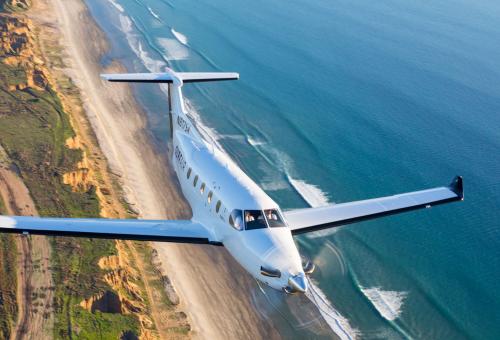 Business Jet Flying To Illustrate Flying Privately Through Membership Clubs