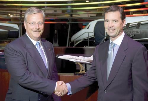Cessna CEO Jack Pelton (left) inks a big deal with XOJet CEO Paul Touw.