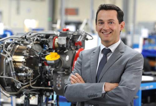 man standing in front of engine