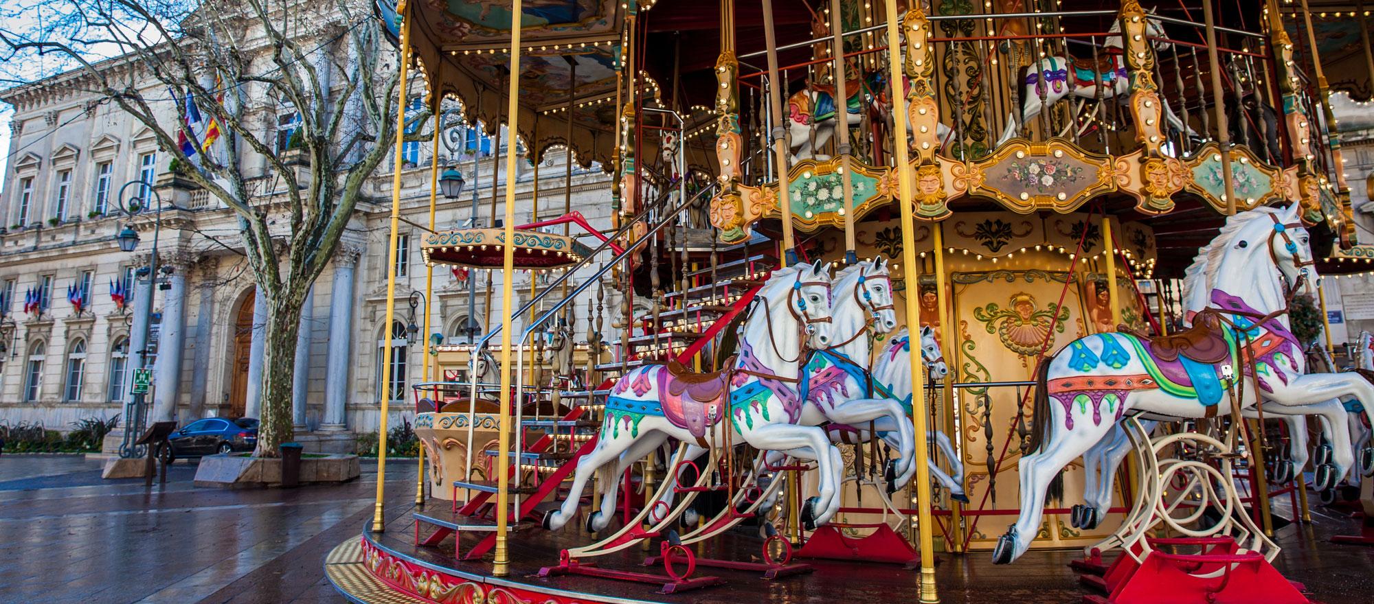 A beautiful carousel near City Hall in Place de l'Horloge (photo: Adobe Stock)