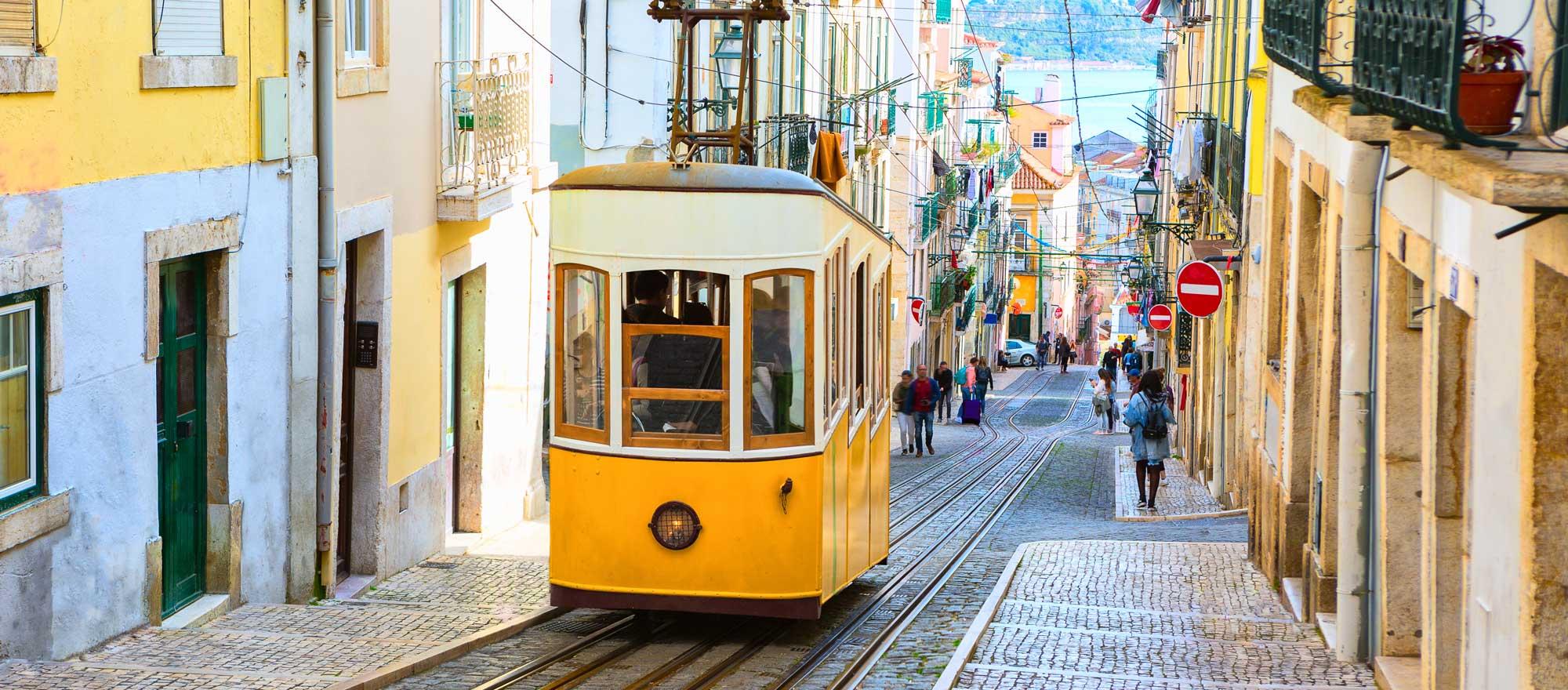 Lisbon's Gloria funicular classified as a national monument opened 1885 located on the west side of the Avenida da Liberdade connects downtown with Bairro Photo: Adobe Stock