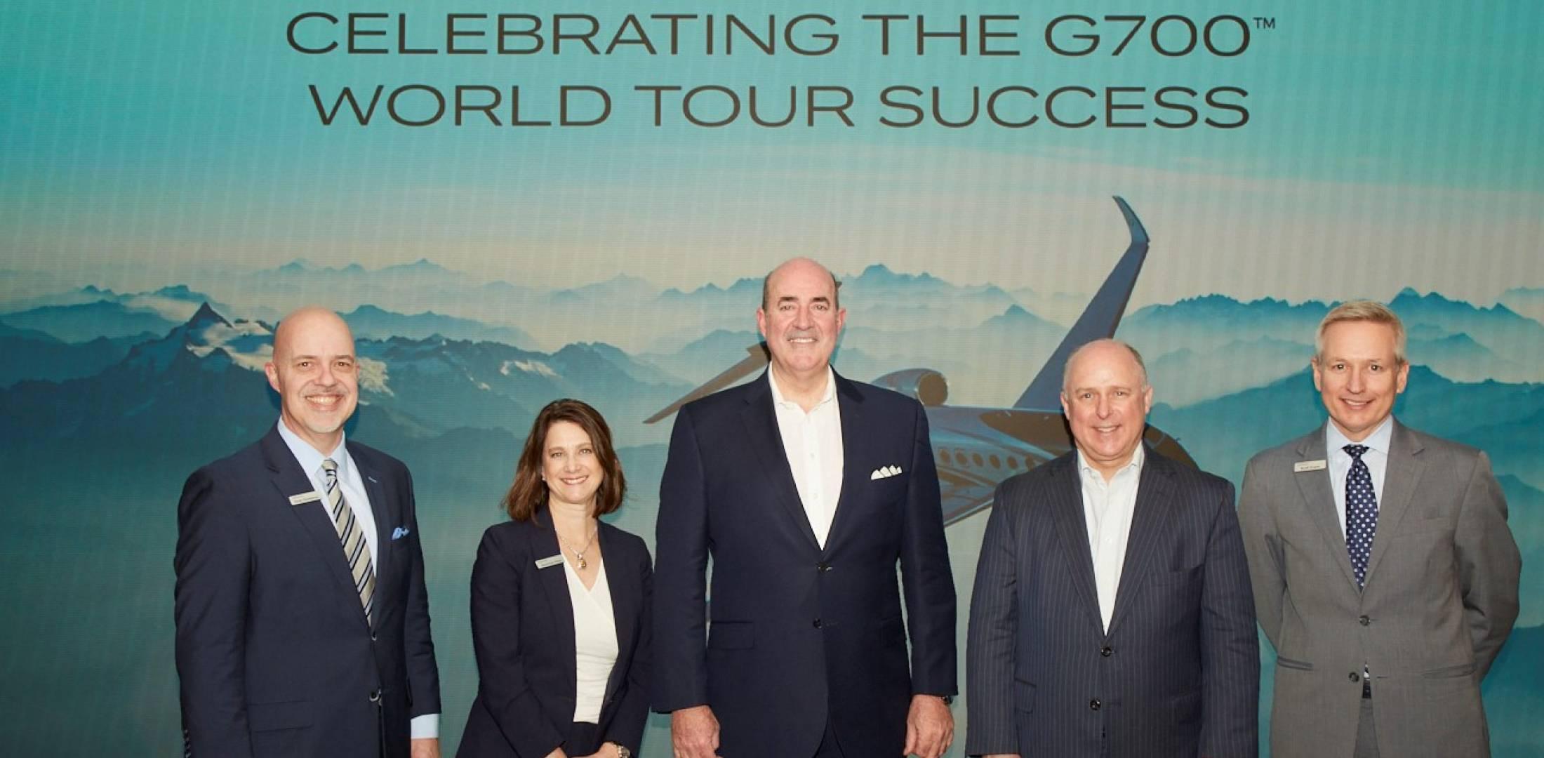At a February 27 gathering at its Manhattan Sales and Design Center, Gulfstream Aerospace president Mark Burns (center) and other company executives celebrate the 25 speed records amassed by the G700 on its recently concluded world tour. The G700 is slated to be FAA certified and enter service this summer. (Photo: Gulfstream Aerospace)