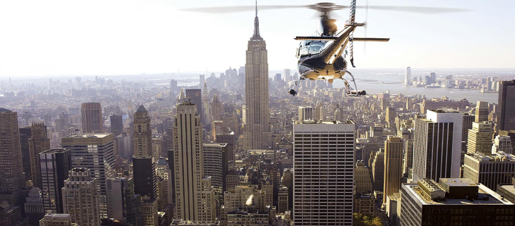 Wings Air Airbus AS350 helicopter in flight over New York City