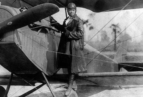 Bessie Coleman and her airplane in 1922