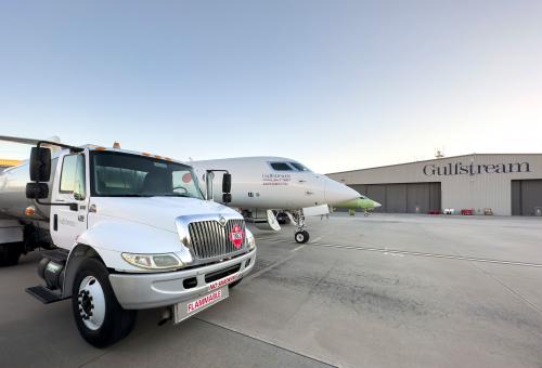 Gulfstream G650 and fuel tanker on airport ramp in front of Gulfstream hangar
