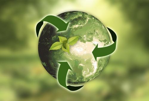 Digital illustration of a green planet with arrows suggesting sustainability