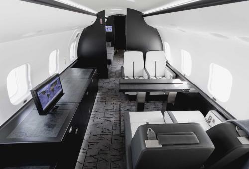Cabin of fully customized Bombardier Global Express featuring a "clean, bright, minimalist color palette."